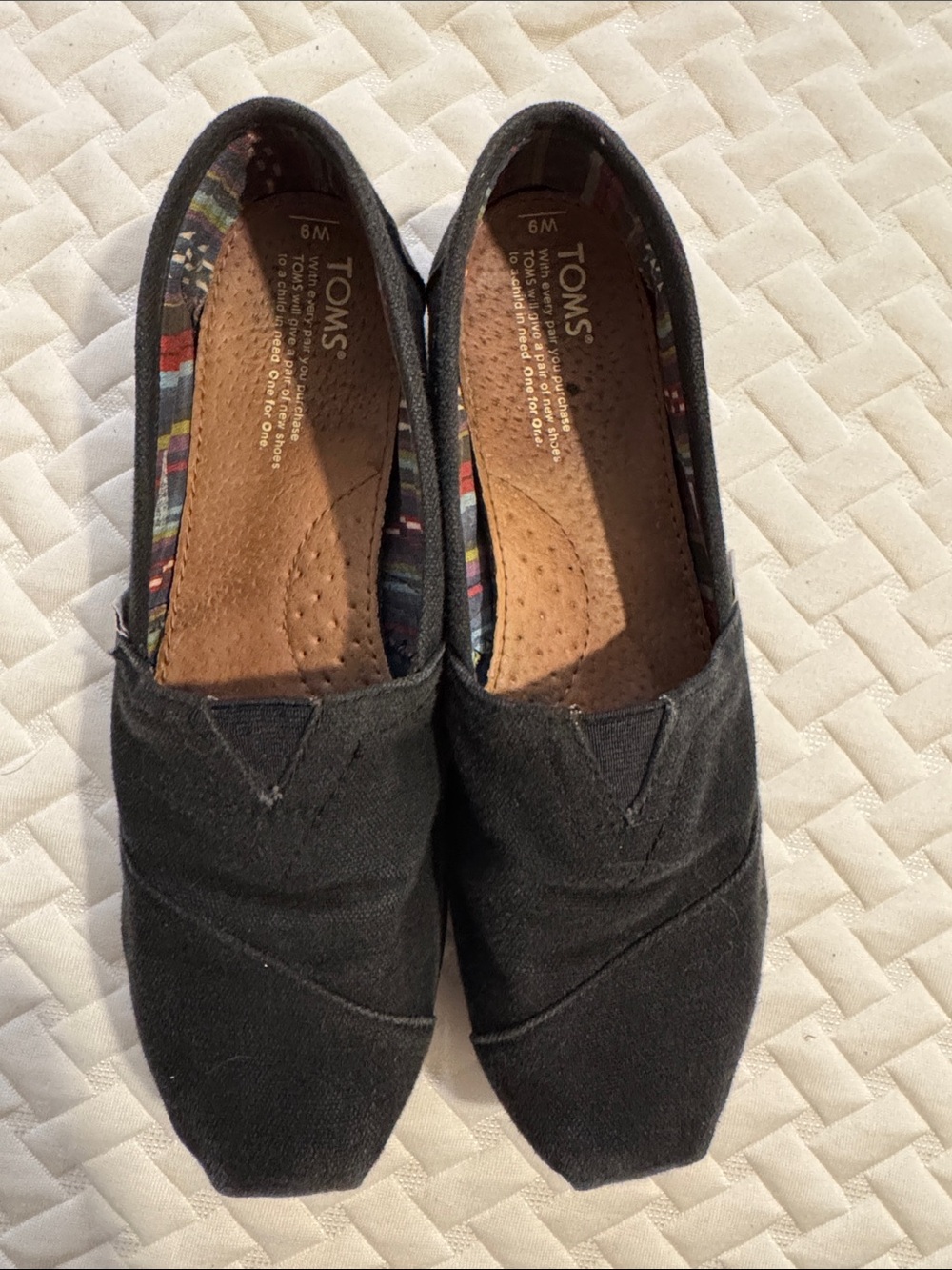 TOMS Black Canvas Women's Slip-On Flats with Patterned Lining